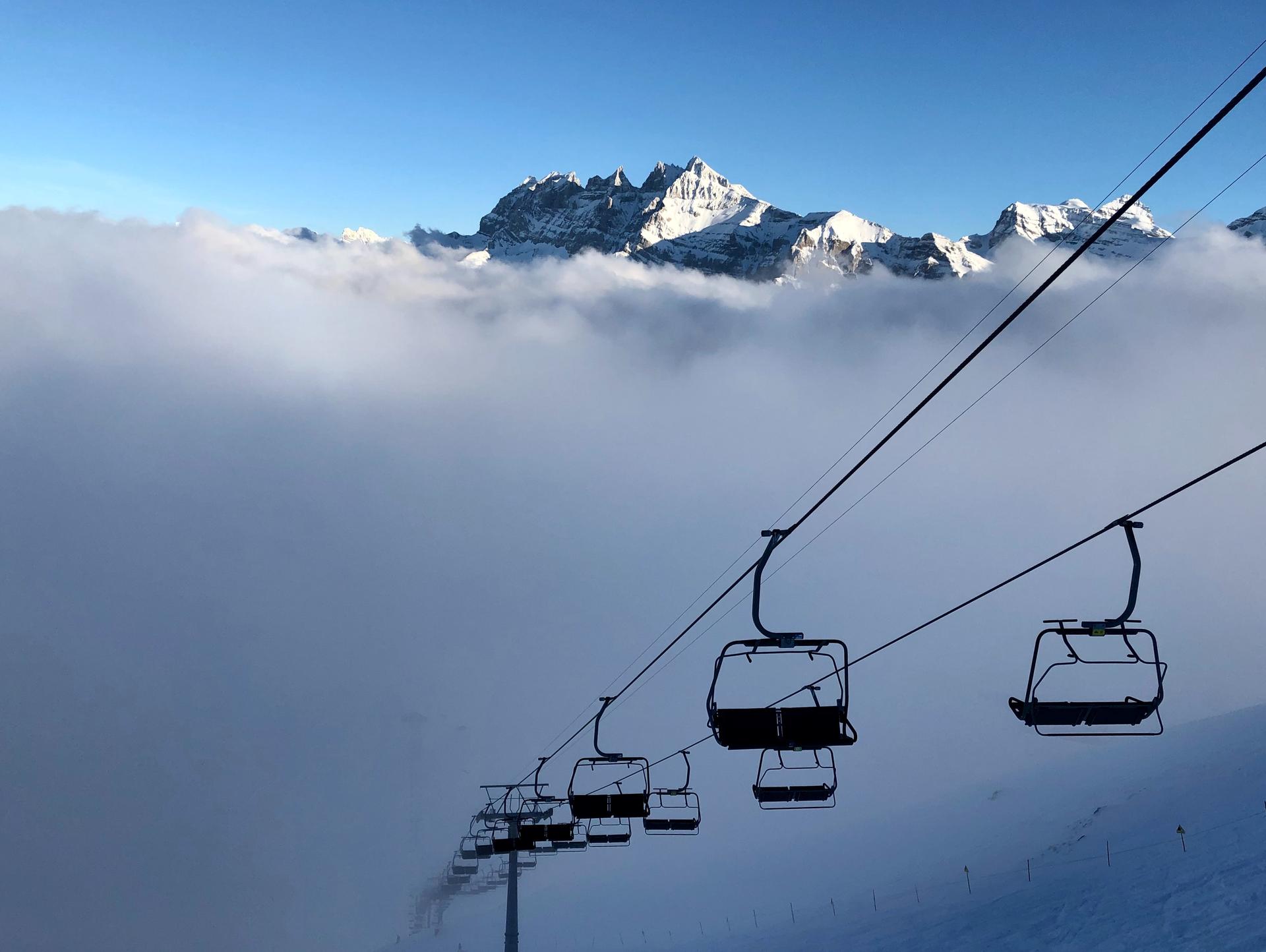 Vigo Di Fassa chairlift into clouds
