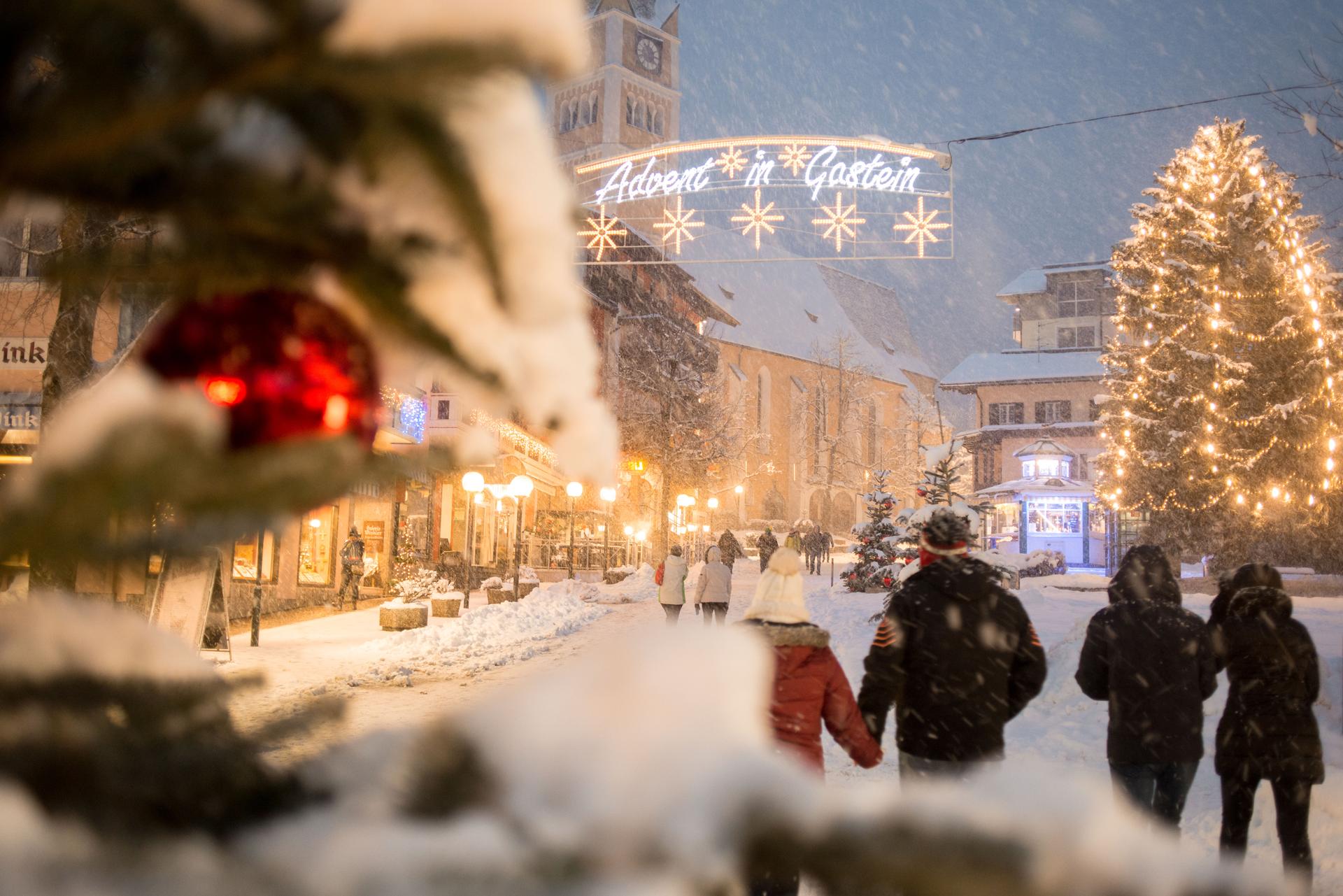 Couples enjoying christmas in traditional christmas market in winter